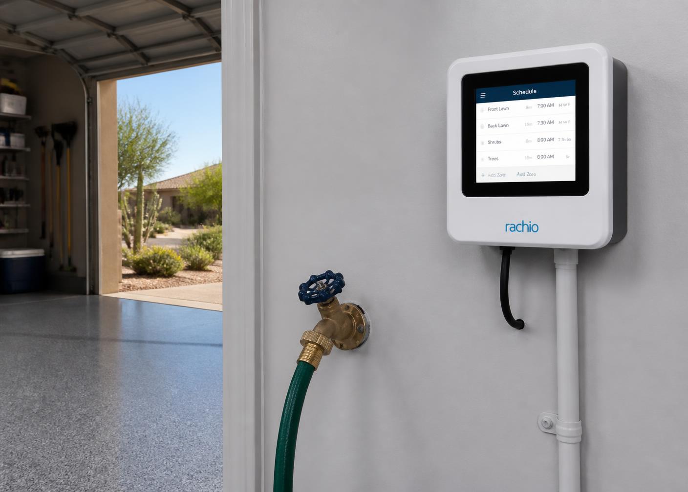 Wall mounted smart irrigation controller showing a zone watering schedule next to a hose bib in an Arizona garage